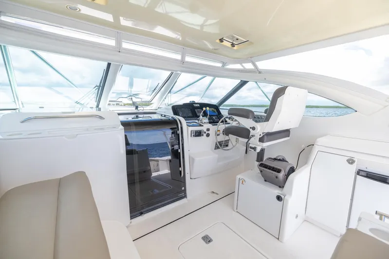 Mutiny Yacht Photos Pics 2004 Tiara Yachts 4200 Open helm station with modern controls and seating.