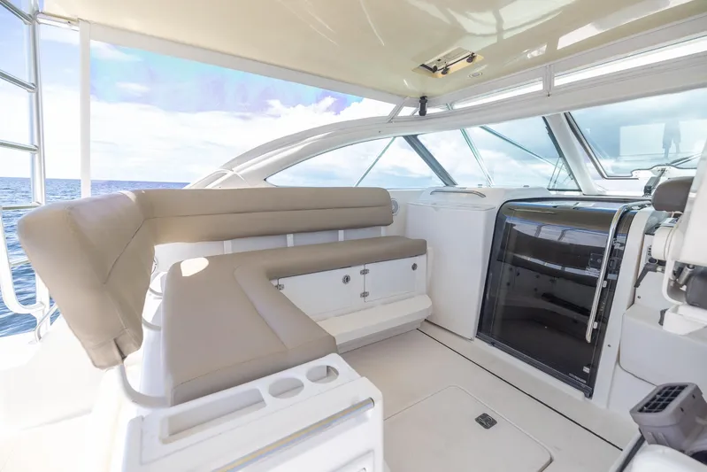 Mutiny Yacht Photos Pics 2004 Tiara Yachts 4200 Open interior with beige seating and ocean view.