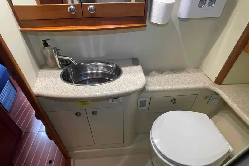 Snail'n Yacht Photos Pics Bathroom interior of 2010 Hunter 45 Center Cockpit yacht with sink and toilet.