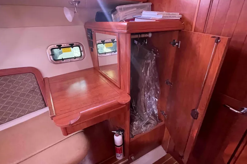 Snail'n Yacht Photos Pics Interior of 2010 Hunter 45 Center Cockpit with wooden cabinetry and storage space.