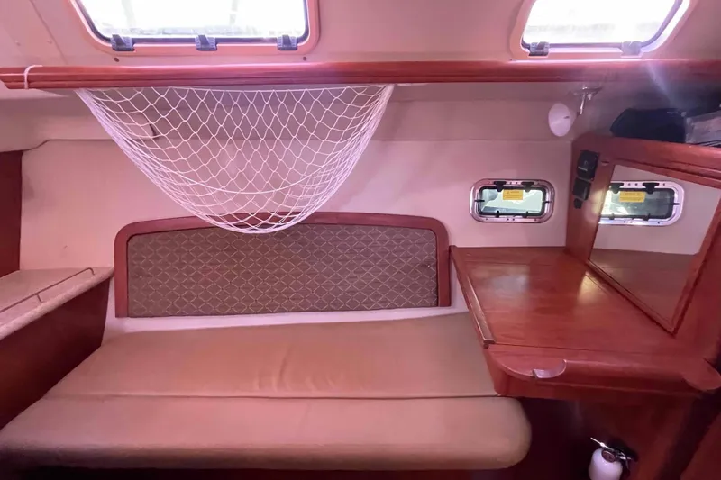 Snail'n Yacht Photos Pics Interior of 2010 Hunter 45 Center Cockpit with cozy seating and wooden table.