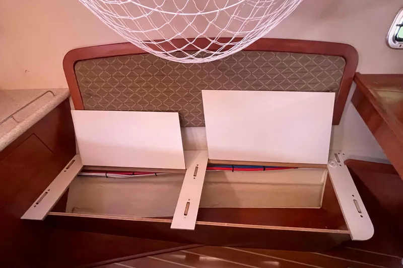 Snail'n Yacht Photos Pics Interior storage compartment of 2010 Hunter 45 Center Cockpit sailboat with open panels.