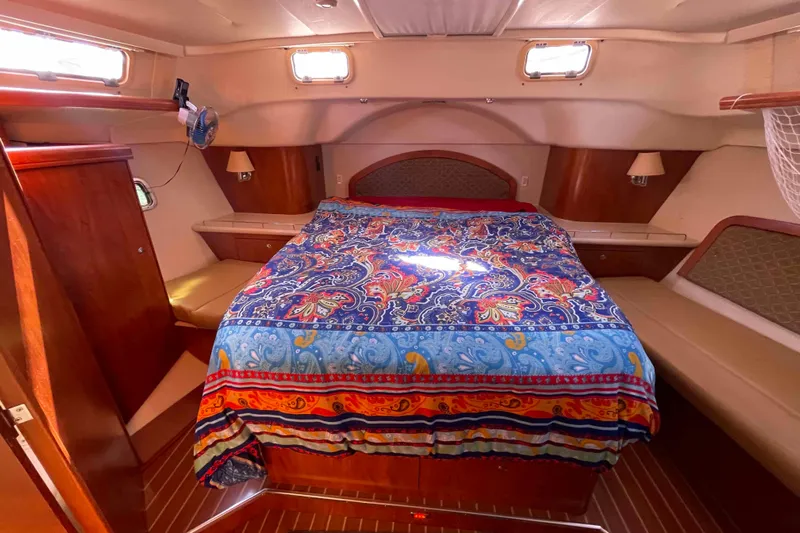 Snail'n Yacht Photos Pics Luxurious cabin interior of 2010 Hunter 45 Center Cockpit with vibrant bedding.