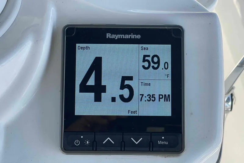 Snail'n Yacht Photos Pics Raymarine display on 2010 Hunter 45 Center Cockpit showing depth, sea temperature, and time.