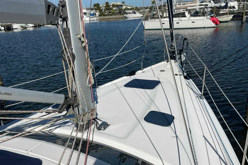 Snail'n Yacht Photos Pics Sailboat deck view of 2010 Hunter 45 Center Cockpit in marina setting.