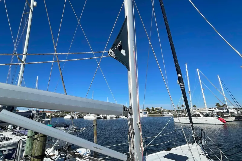 Snail'n Yacht Photos Pics Sailboat mast and rigging of 2010 Hunter 45 Center Cockpit in marina setting.