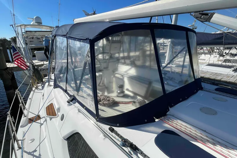 Snail'n Yacht Photos Pics 2010 Hunter 45 Center Cockpit sailboat with enclosed cockpit, docked at marina.