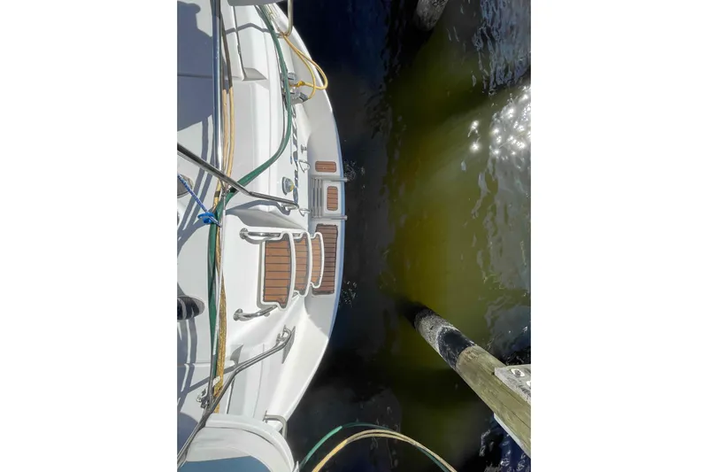 Snail'n Yacht Photos Pics Overhead view of 2010 Hunter 45 Center Cockpit yacht docked by wooden pier.