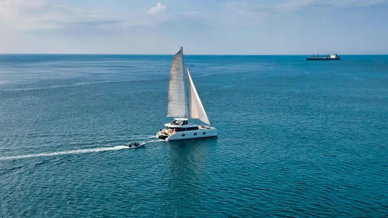 Feel The Blue Yacht Photos Pics Sailing yacht Sunreef 60 (2018) on open sea with clear skies.