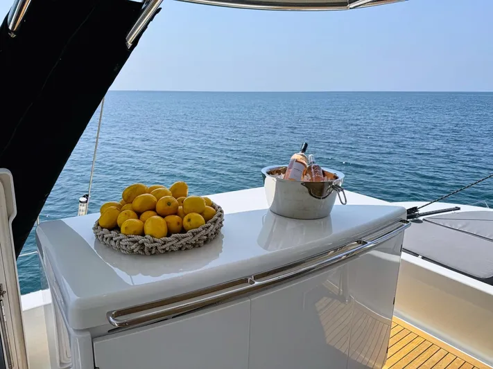Feel The Blue Yacht Photos Pics Sunreef 60 yacht deck with lemons and champagne, ocean view, 2018 model.