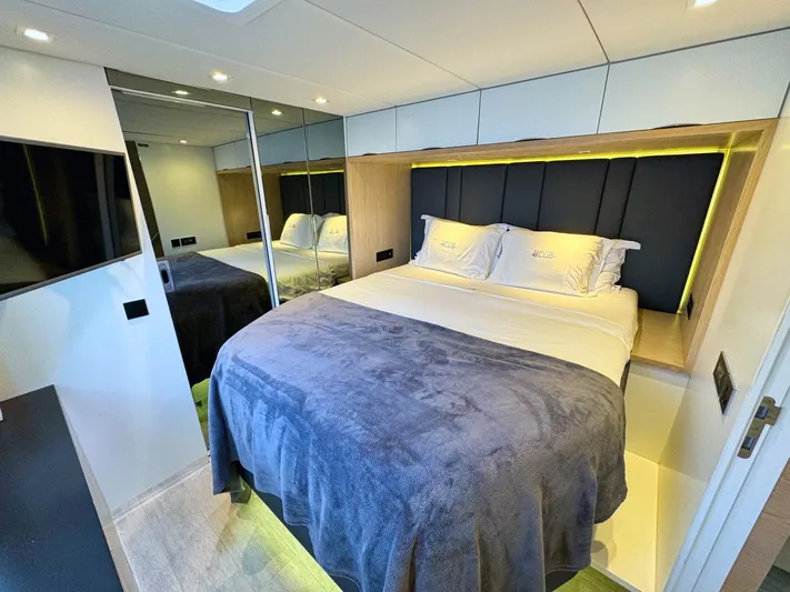 Feel The Blue Yacht Photos Pics Luxurious bedroom interior of 2018 Sunreef 60 yacht with modern design and cozy bedding.