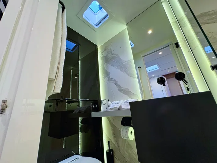 Feel The Blue Yacht Photos Pics Luxurious bathroom interior of 2018 Sunreef 60 yacht with modern fixtures and skylights.
