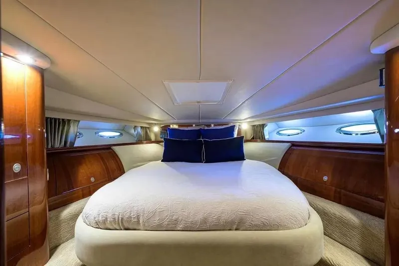 Still The One Yacht Photos Pics Luxurious cabin interior of 2004 Sea Ray 550 Sundancer yacht with elegant bedding.