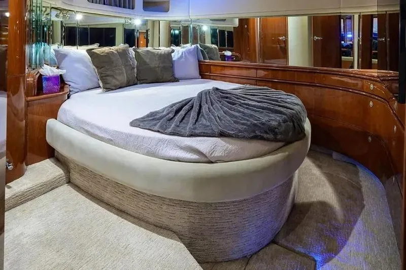 Still The One Yacht Photos Pics Luxurious bedroom interior of 2004 Sea Ray 550 Sundancer yacht with plush bedding.