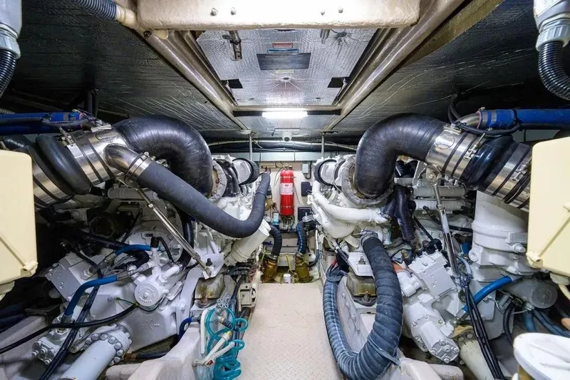 Still The One Yacht Photos Pics Engine room of 2004 Sea Ray 550 Sundancer yacht, showcasing dual engines and mechanical systems.
