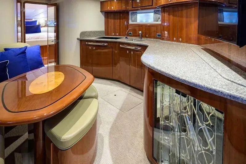 Still The One Yacht Photos Pics Luxurious interior of 2004 Sea Ray 550 Sundancer yacht with elegant wood finishes and modern amenities.