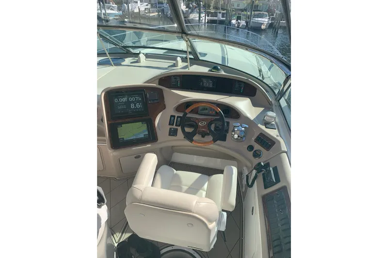 Still The One Yacht Photos Pics 2004 Sea Ray 550 Sundancer helm with navigation screens and controls.