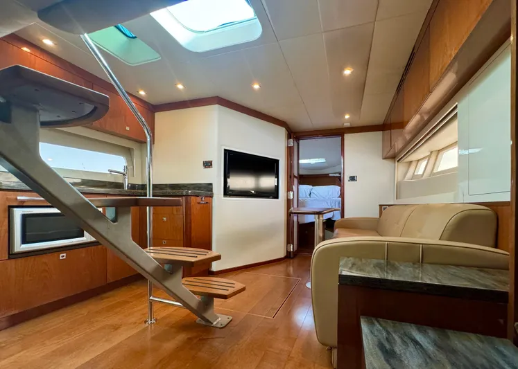  Yacht Photos Pics Luxurious interior of 2013 Sea Ray 410 Sundancer yacht with modern amenities and elegant design.