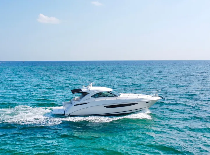  Yacht Photos Pics 2013 Sea Ray 410 Sundancer cruising on open blue ocean.