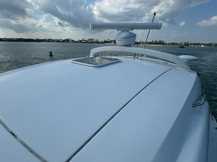  Yacht Photos Pics 2013 Sea Ray 410 Sundancer yacht on calm waters under cloudy sky.
