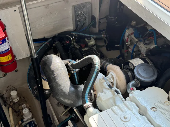  Yacht Photos Pics Engine compartment of 2013 Sea Ray 410 Sundancer with visible components and fire extinguisher.