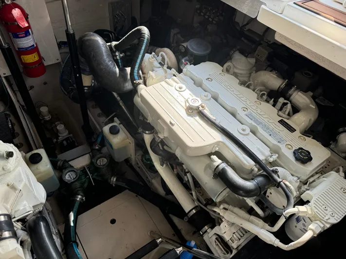  Yacht Photos Pics Engine compartment of 2013 Sea Ray 410 Sundancer boat, showcasing detailed machinery and components.