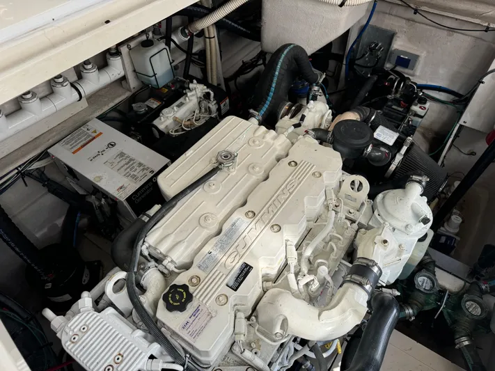 Yacht Photos Pics Engine compartment of 2013 Sea Ray 410 Sundancer boat, showcasing detailed machinery.