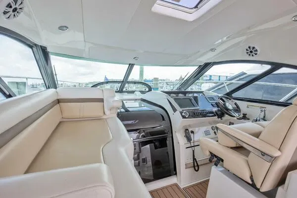  Yacht Photos Pics Luxurious interior of 2013 Sea Ray 410 Sundancer yacht with modern helm and seating.