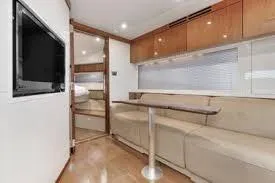  Yacht Photos Pics Luxurious interior of 2013 Sea Ray 410 Sundancer yacht with modern seating and TV.