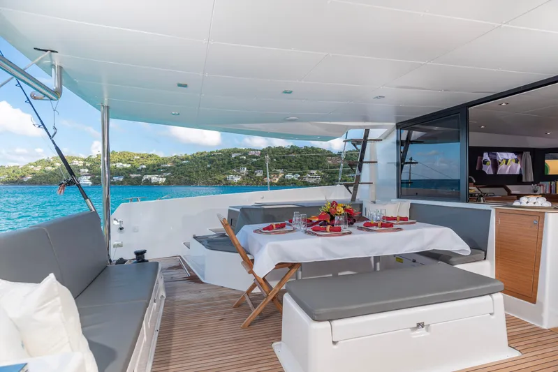 Aquanimity Yacht Photos Pics Luxurious 2021 Dufour 48 yacht with elegant outdoor dining area and scenic ocean view.