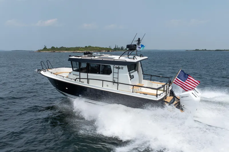 Stock 6 Yacht Photos Pics 2026 Targa 32 GT boat cruising on open water with American flag.