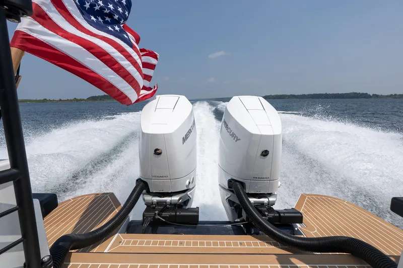 Stock 6 Yacht Photos Pics Targa 32 GT 2026 boat with dual Mercury engines and American flag on open water.