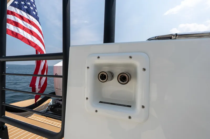 Stock 6 Yacht Photos Pics Targa 32 GT 2026 boat detail with American flag and ocean backdrop.