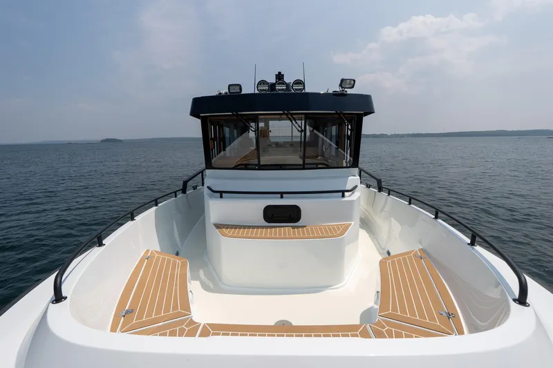 Stock 6 Yacht Photos Pics 2026 Targa 32 GT boat on open water, showcasing sleek design and spacious deck.