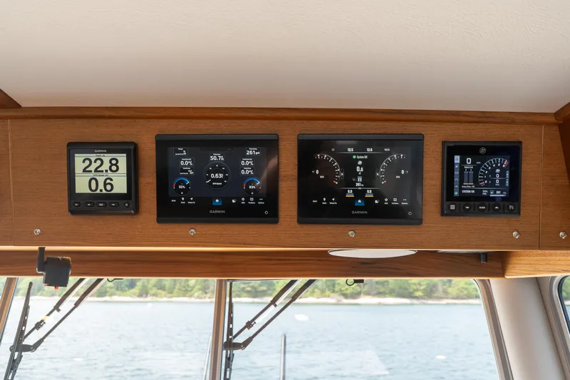 Stock 6 Yacht Photos Pics Targa 32 GT 2026 dashboard with Garmin navigation displays on a wooden panel.