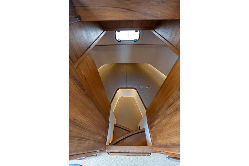 Stock 6 Yacht Photos Pics Interior view of 2026 Targa 32 GT boat cabin with wooden finish.