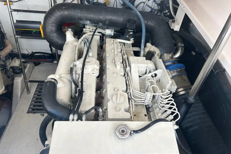 Freedom Yacht Photos Pics Engine compartment of a 2004 Tiara Yachts 36 Sovran, showcasing mechanical components.
