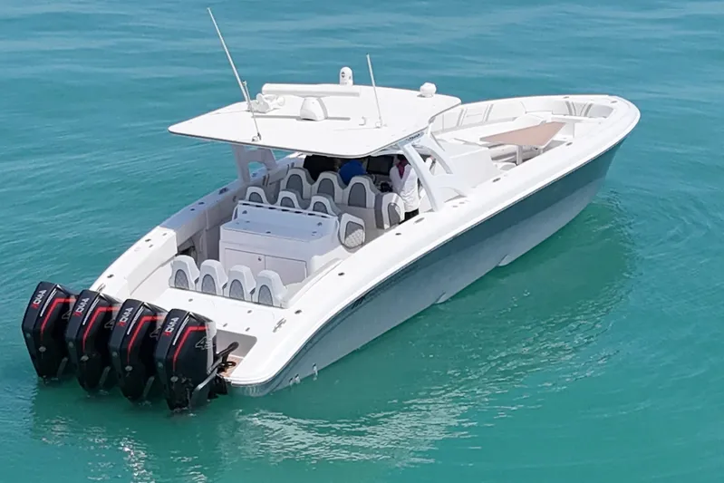  Yacht Photos Pics 2017 Midnight Express 43 Open boat with four engines on turquoise water.