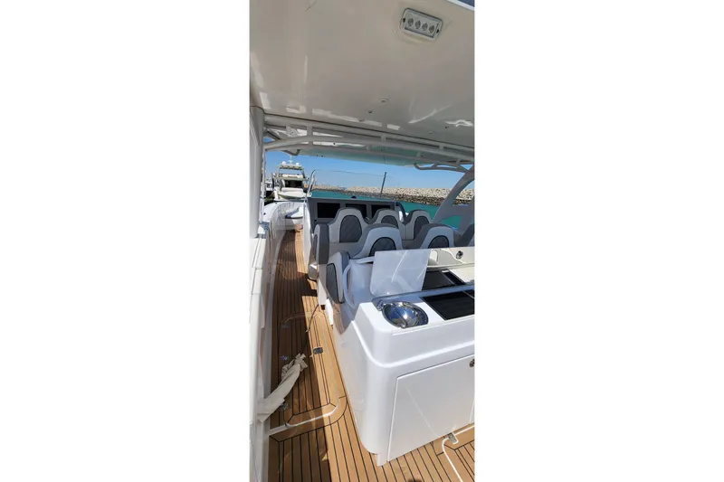  Yacht Photos Pics 2017 Midnight Express 43 Open boat interior with seating and wooden deck.