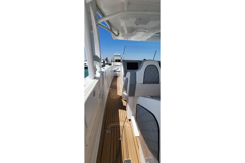  Yacht Photos Pics 2017 Midnight Express 43 Open boat interior with sleek seating and wooden deck.