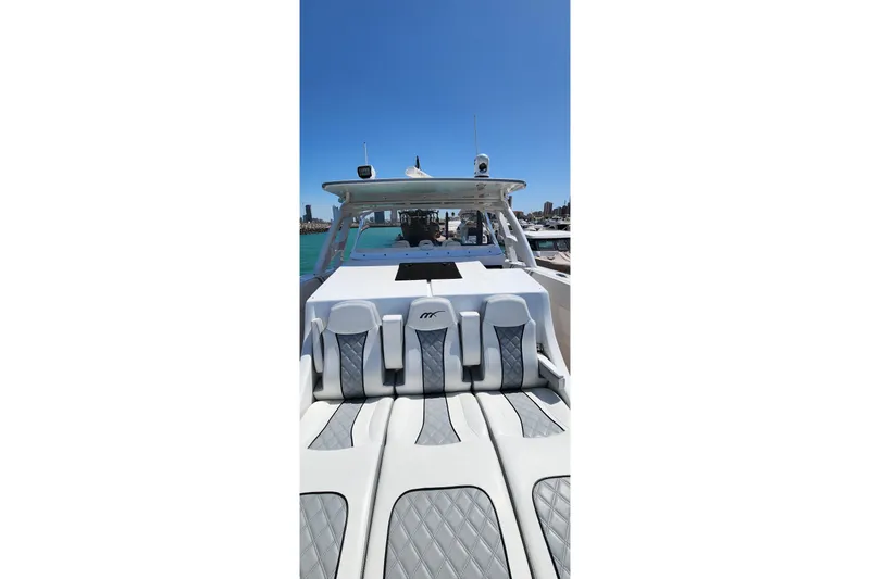  Yacht Photos Pics 2017 Midnight Express 43 Open boat with luxury seating and clear blue sky backdrop.