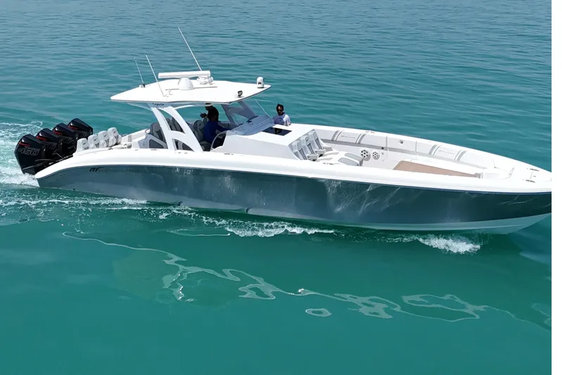  Yacht Photos Pics 2017 Midnight Express 43 Open boat cruising on clear turquoise water.