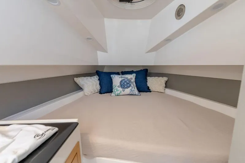  Yacht Photos Pics Cozy cabin interior of 2025 SeaWell 345XL boat with decorative pillows.