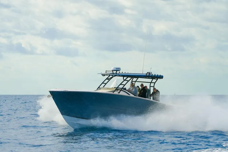  Yacht Photos Pics 2025 SeaWell 345XL boat cruising on open water with passengers onboard.