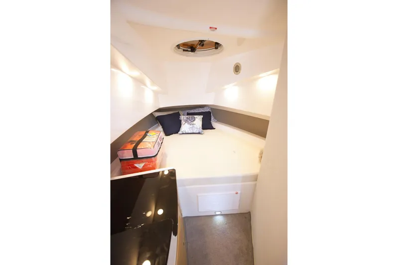  Yacht Photos Pics Cozy cabin interior of 2025 SeaWell 345XL boat with bed and cushions.