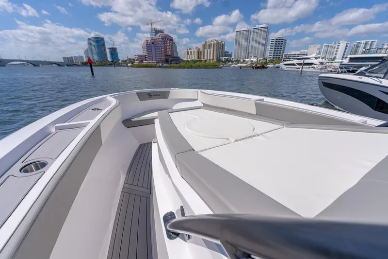  Yacht Photos Pics 2025 SeaWell 345XL boat on water with city skyline in background.