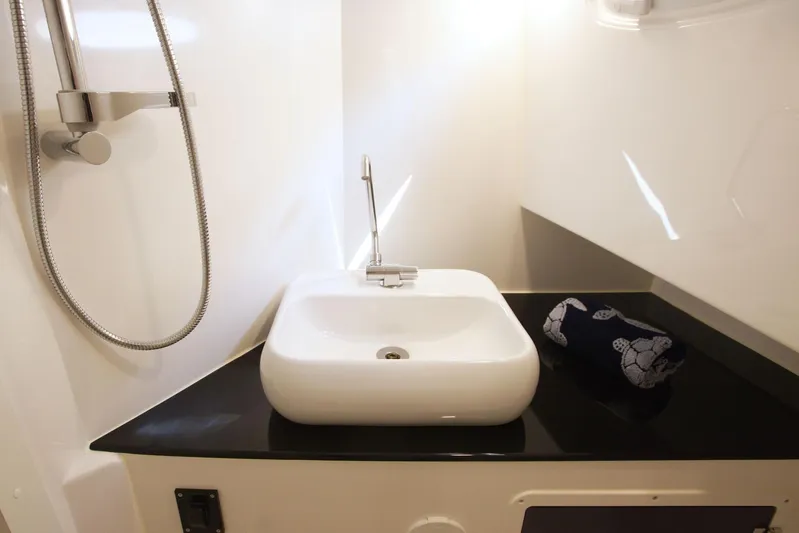  Yacht Photos Pics Modern bathroom sink and shower in SeaWell 345XL, 2025 model yacht.