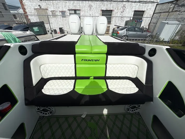  Yacht Photos Pics Interior of a 2000 Fountain Lightning boat with green and white seating.