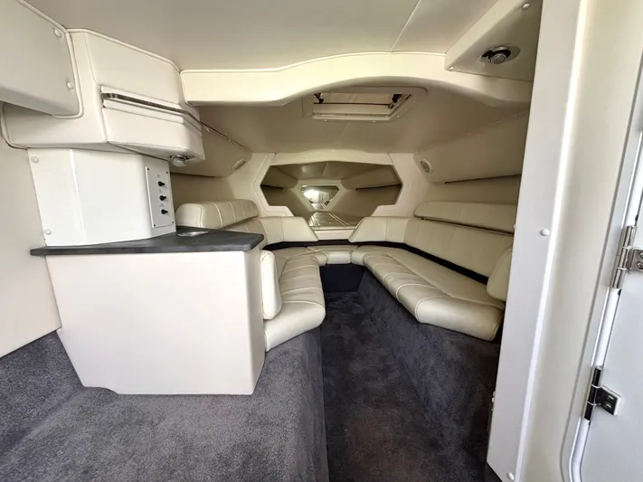  Yacht Photos Pics Interior of a 2000 Fountain Lightning boat with beige seating and modern design.