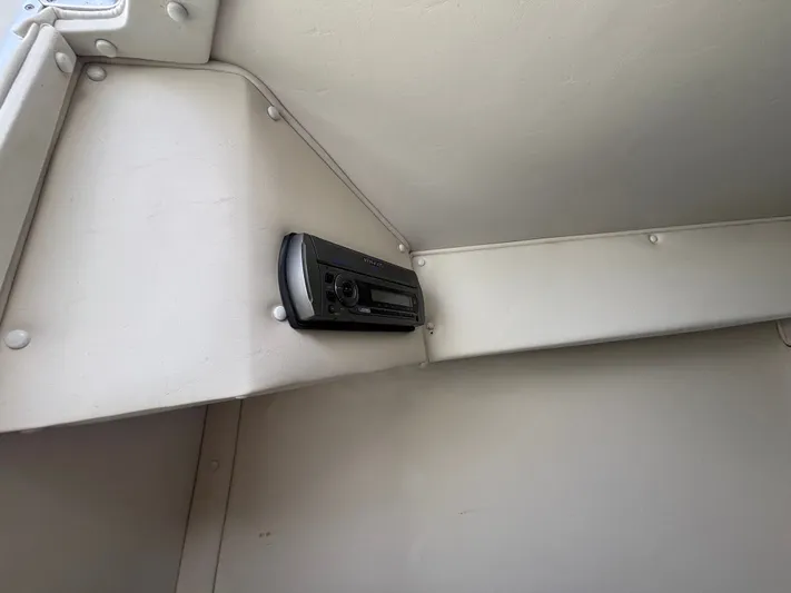  Yacht Photos Pics Boat interior with a mounted stereo system, Fountain Lightning 2000 model.